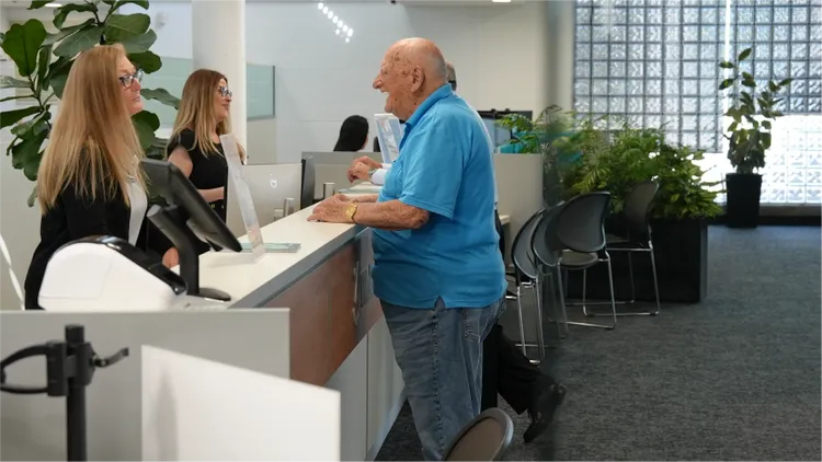 A Teachers Mutual Bank Limited member shares a joke with one of our branch staff.